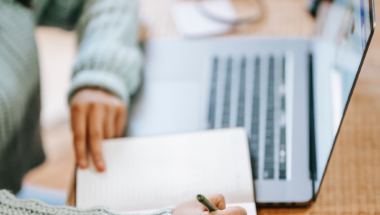 woman conducting website audit on laptop