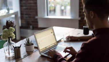 Man at a laptop in an office setting